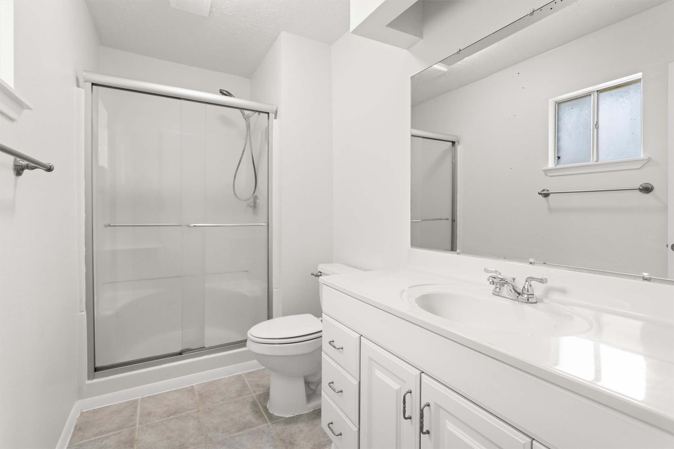 11319 Rousseau Drive Houston, TX 77065 - Photo 14 of 29 The primary bathroom features an updated walk in shower.