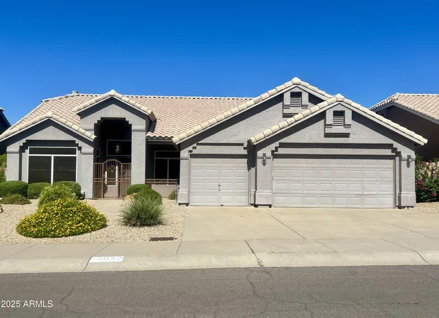 a front view of a house with a garage