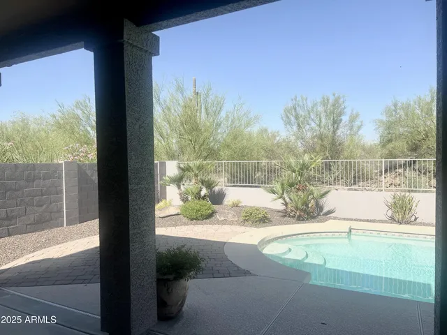 a view of a small yard from a balcony