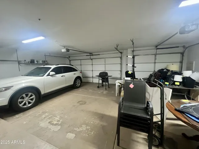 a view of parking garage with cars parked