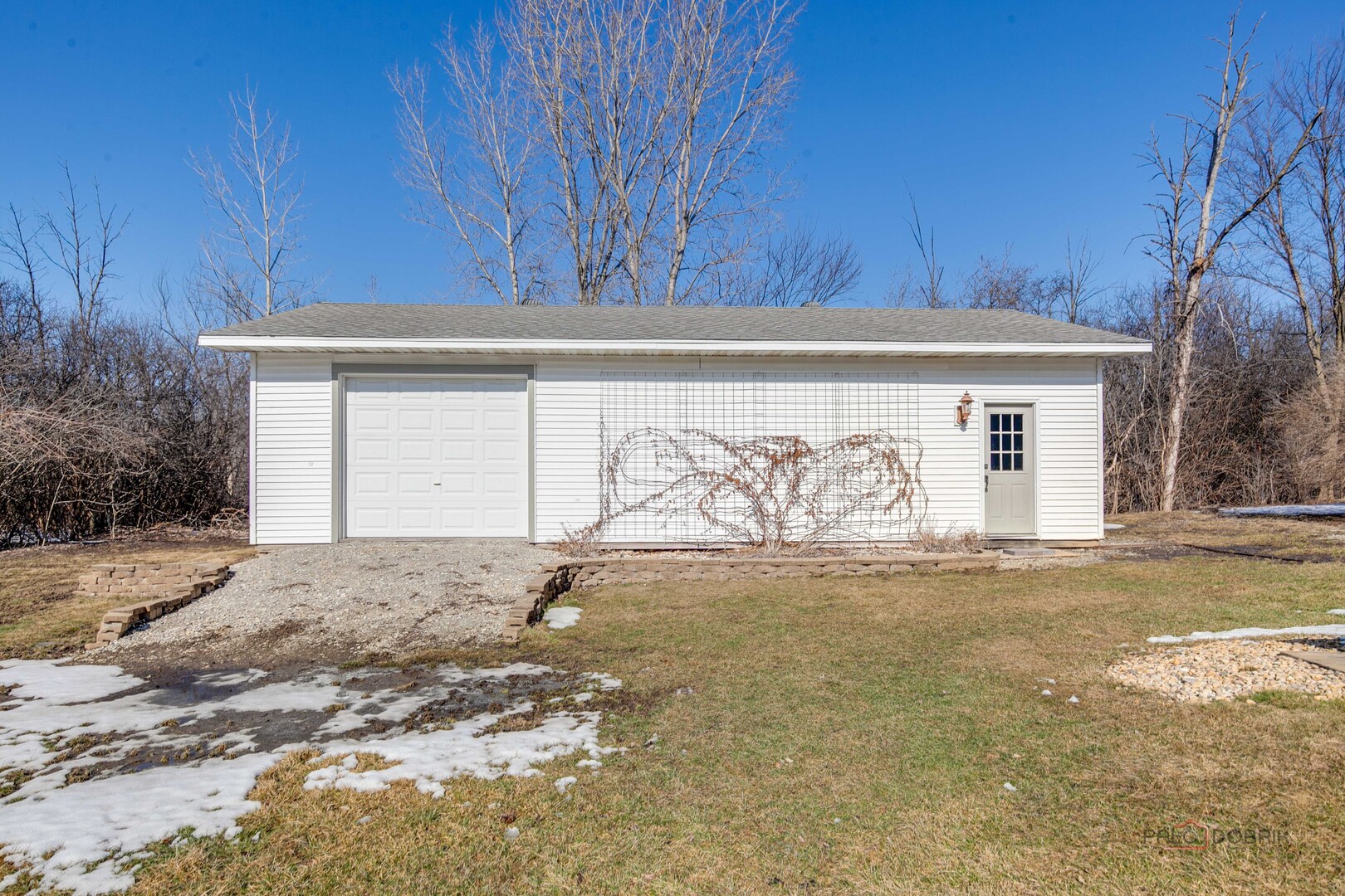 25900 North St Marys Road Libertyville, IL 60048 - Photo 45 of 56 a front view of a house with parking space and a wooden fence