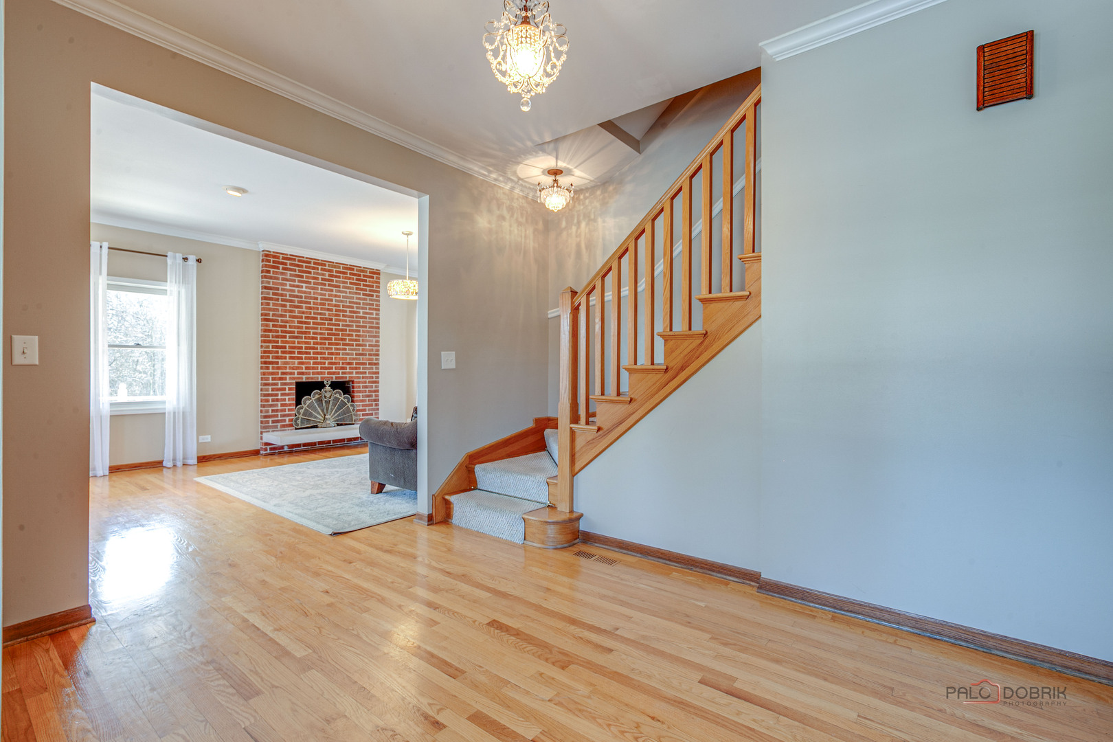 25900 North St Marys Road Libertyville, IL 60048 - Photo 6 of 56 a view of a hallway view with wooden floor and staircase