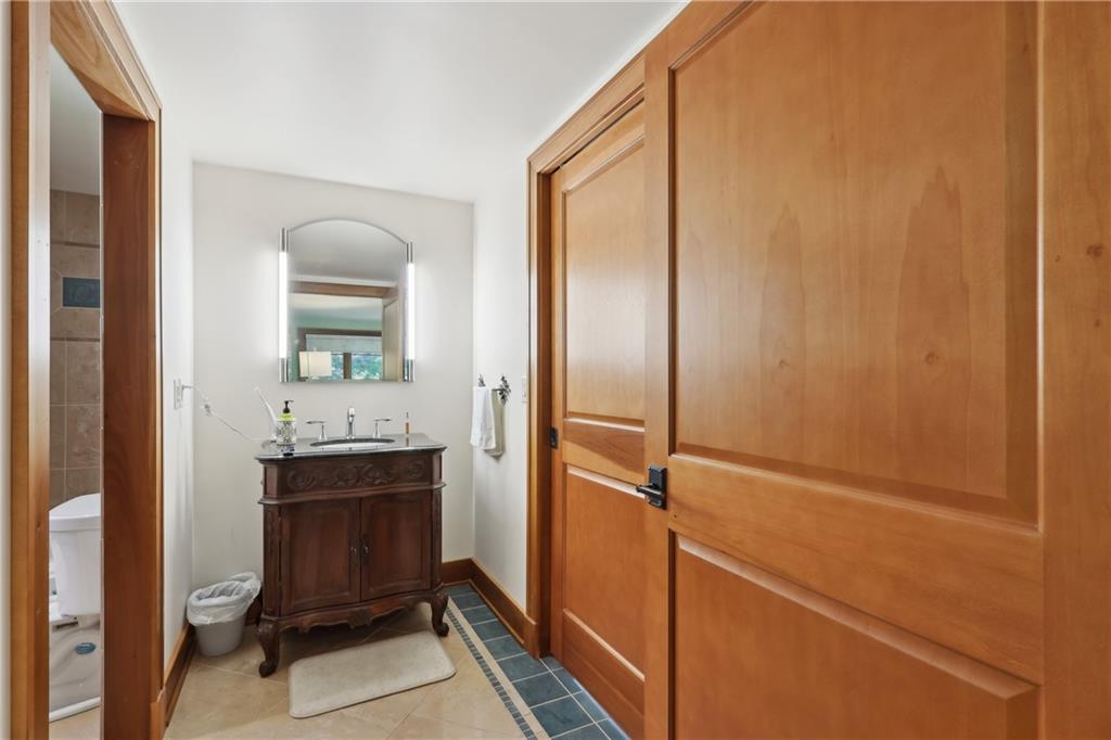 542 North Monroe Street Butler, PA 16001 - Photo 23 of 39 a bathroom with a granite countertop sink a toilet and mirror