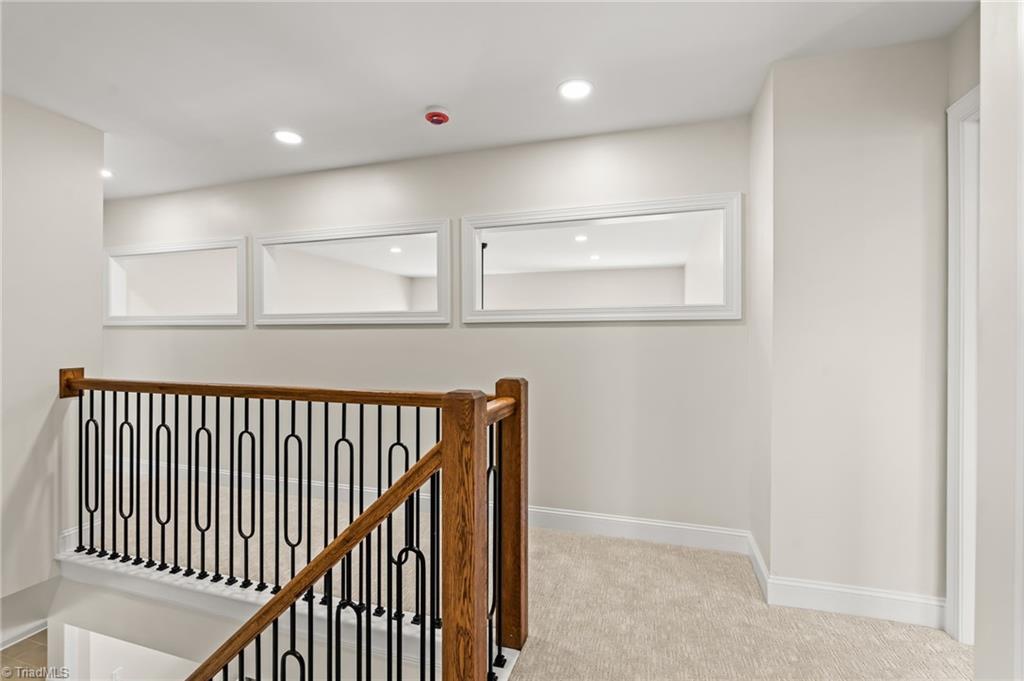 8419 Pheasant Ridge Drive Colfax, NC 27235 - Photo 27 of 49 Upstairs entry w/Custom iron balusters and these unique windows allow streaming light from the two story Living space
