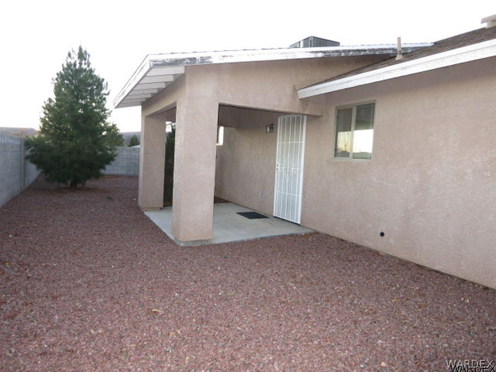 3661 North Kenneth Road Kingman, AZ 86409 - Photo 15 of 18 a view of a house with a backyard
