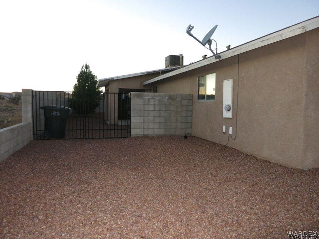 3661 North Kenneth Road Kingman, AZ 86409 - Photo 16 of 18 a view of a house with a backyard