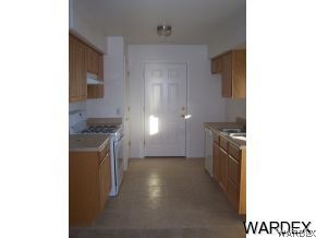 3661 North Kenneth Road Kingman, AZ 86409 - Photo 2 of 18 a view of a kitchen cabinets and a stove