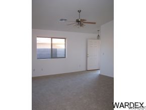 3661 North Kenneth Road Kingman, AZ 86409 - Photo 5 of 18 a view of an empty room with a window