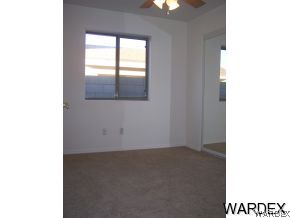 3661 North Kenneth Road Kingman, AZ 86409 - Photo 6 of 18 a view of an empty room with a window