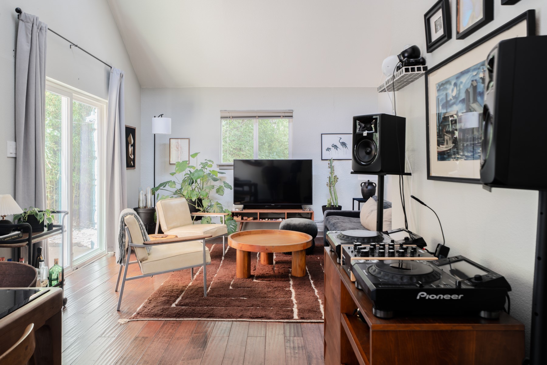 a living room with furniture and a flat screen tv