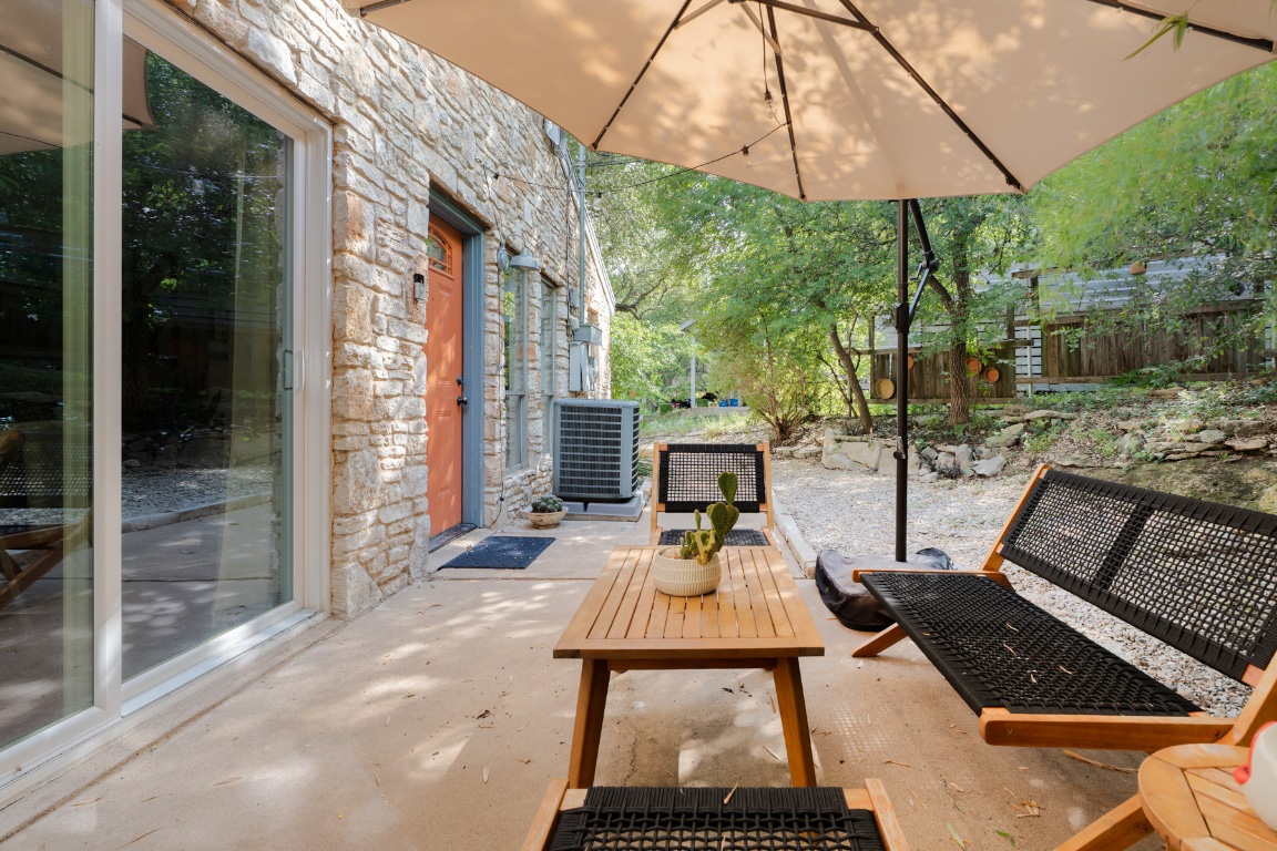 3301 Doolin Drive Austin, TX 78704 - Photo 11 of 32 a table and chairs in the patio of a house