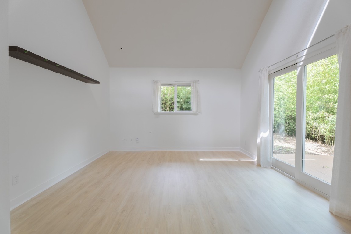 3301 Doolin Drive Austin, TX 78704 - Photo 17 of 32 wooden floor in an empty room with a window