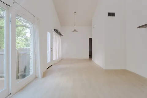 a view of a hallway with a white walls