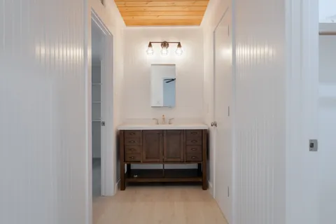 a bathroom with a sink and a mirror