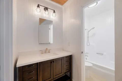a bathroom with a sink and a mirror