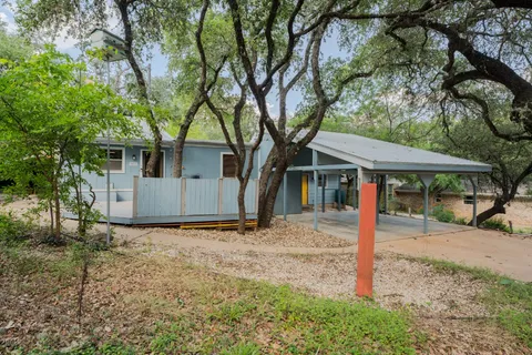 a house with a tree in front of the house