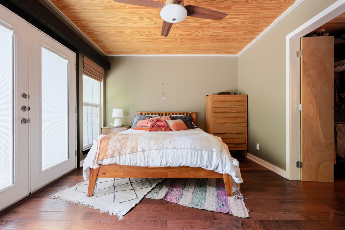 3301 Doolin Drive Austin, TX 78704 - Photo 7 of 32 a bedroom with a bed and wooden floor