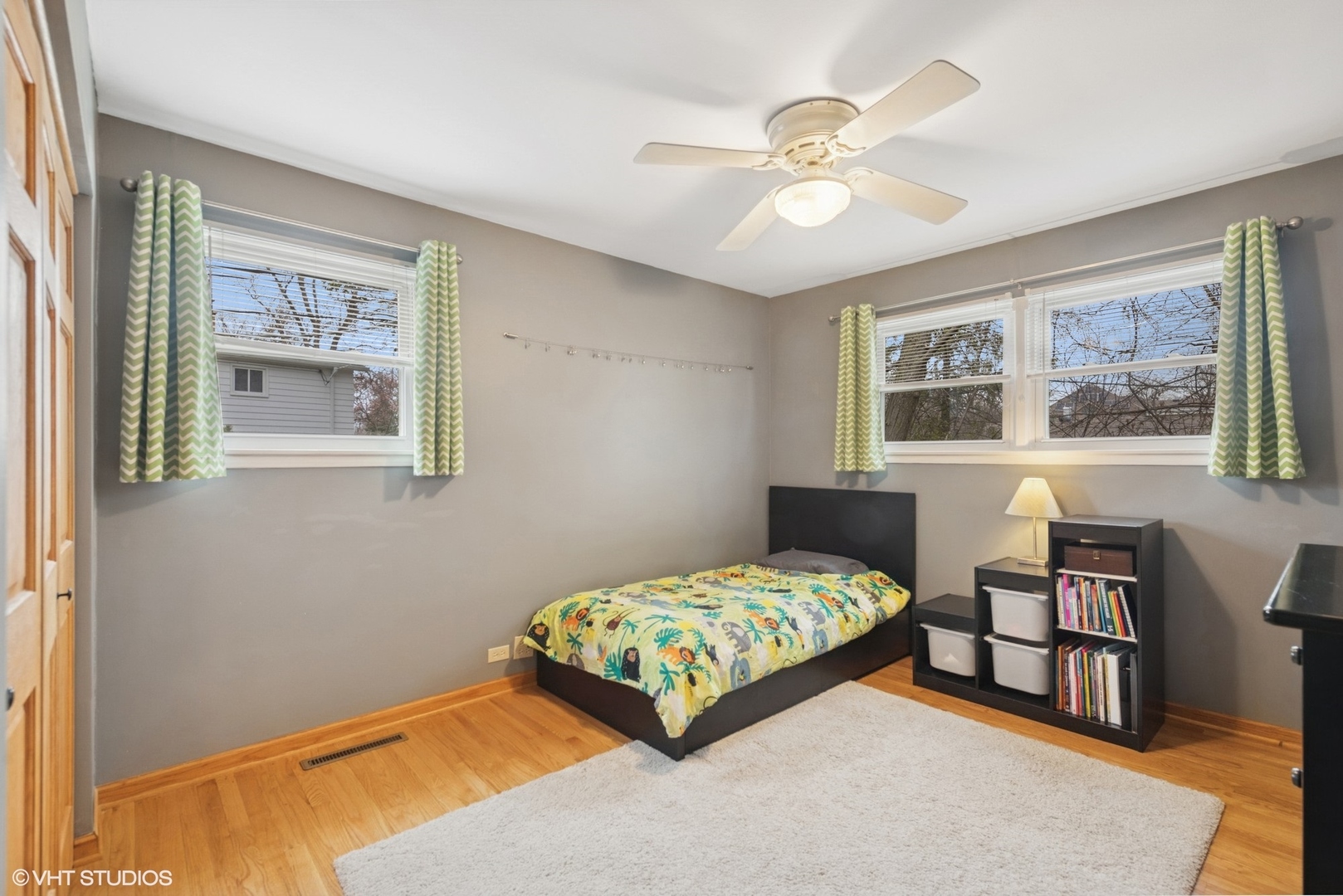 418 Warren Road Glenview, IL 60025 - Photo 12 of 24 a bedroom with a bed and a chandelier