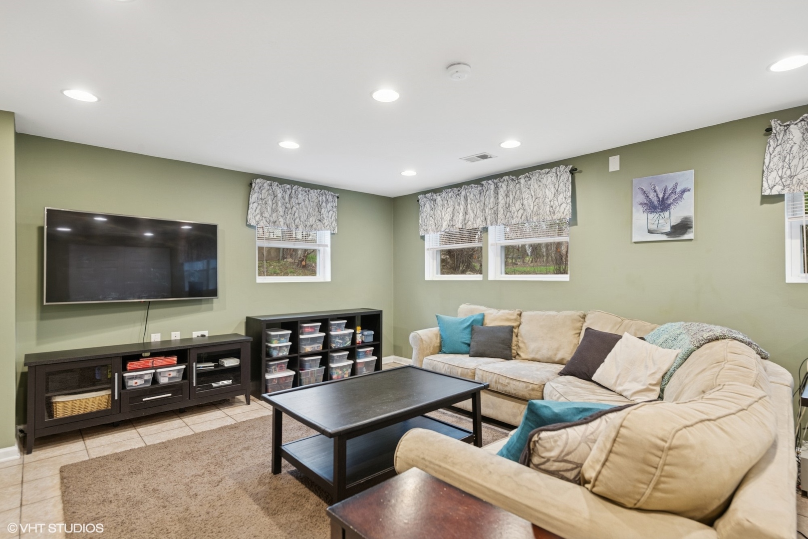 418 Warren Road Glenview, IL 60025 - Photo 14 of 24 a living room with furniture and a flat screen tv