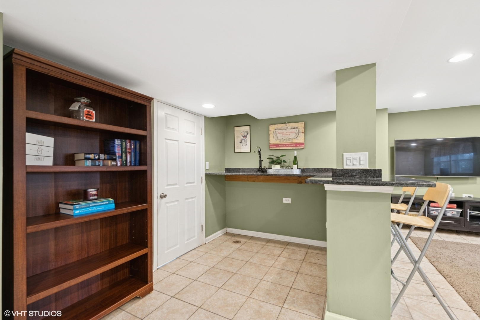 418 Warren Road Glenview, IL 60025 - Photo 17 of 24 a kitchen with a refrigerator and cabinets