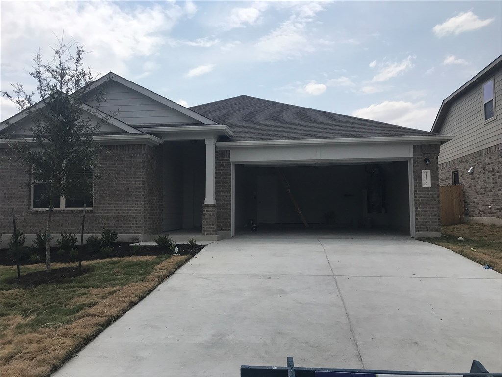 21700 Urraca Lane Pflugerville, TX 78660 - Photo 39 of 40 a house with yard in front of it