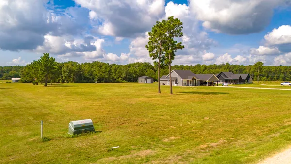 a view of a lake with a building in the background