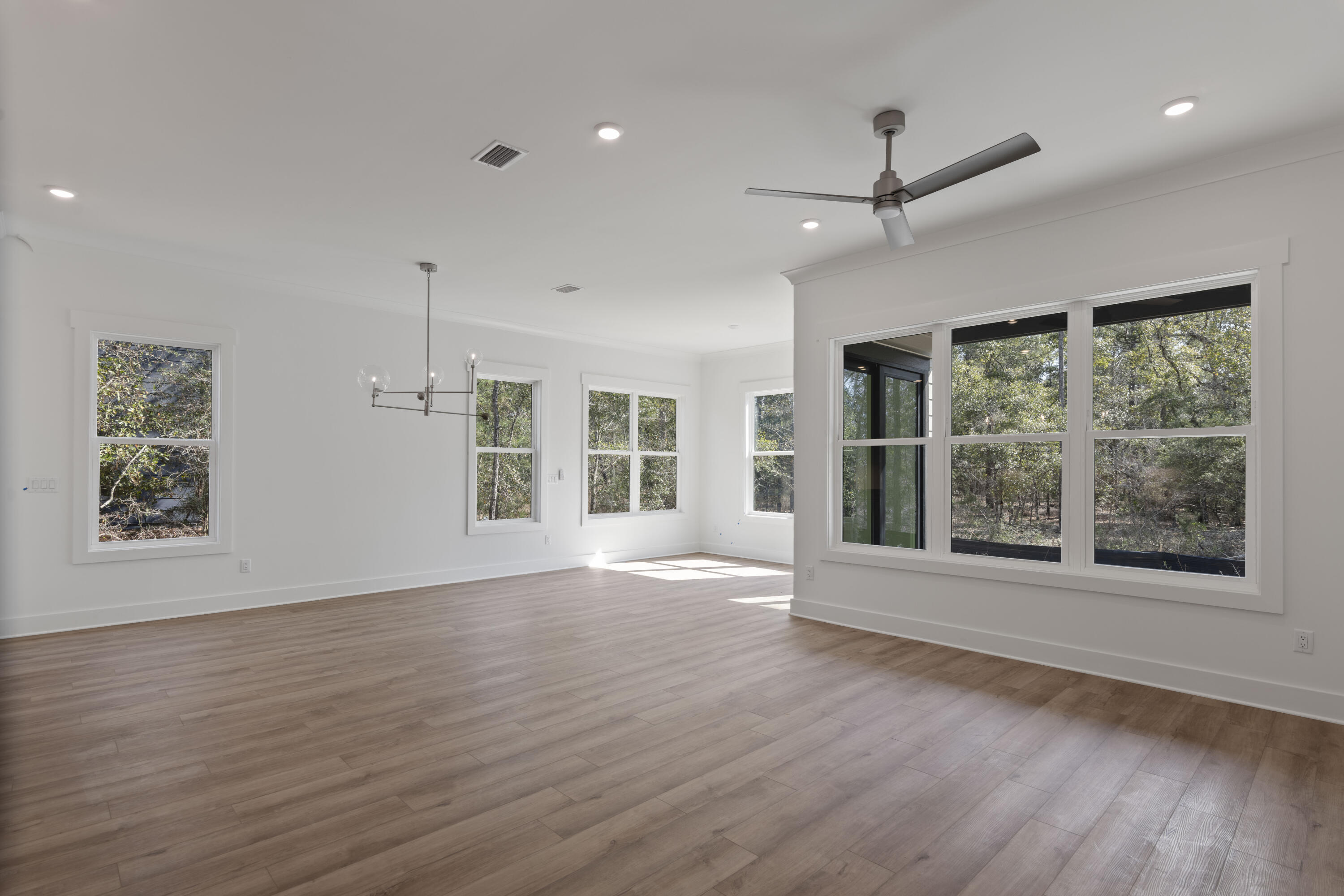 310 Channel Shl Drive, Unit LOT 13 Santa Rosa Beach, FL 32459 - Photo 25 of 77 a view of an empty room with a window and wooden floor