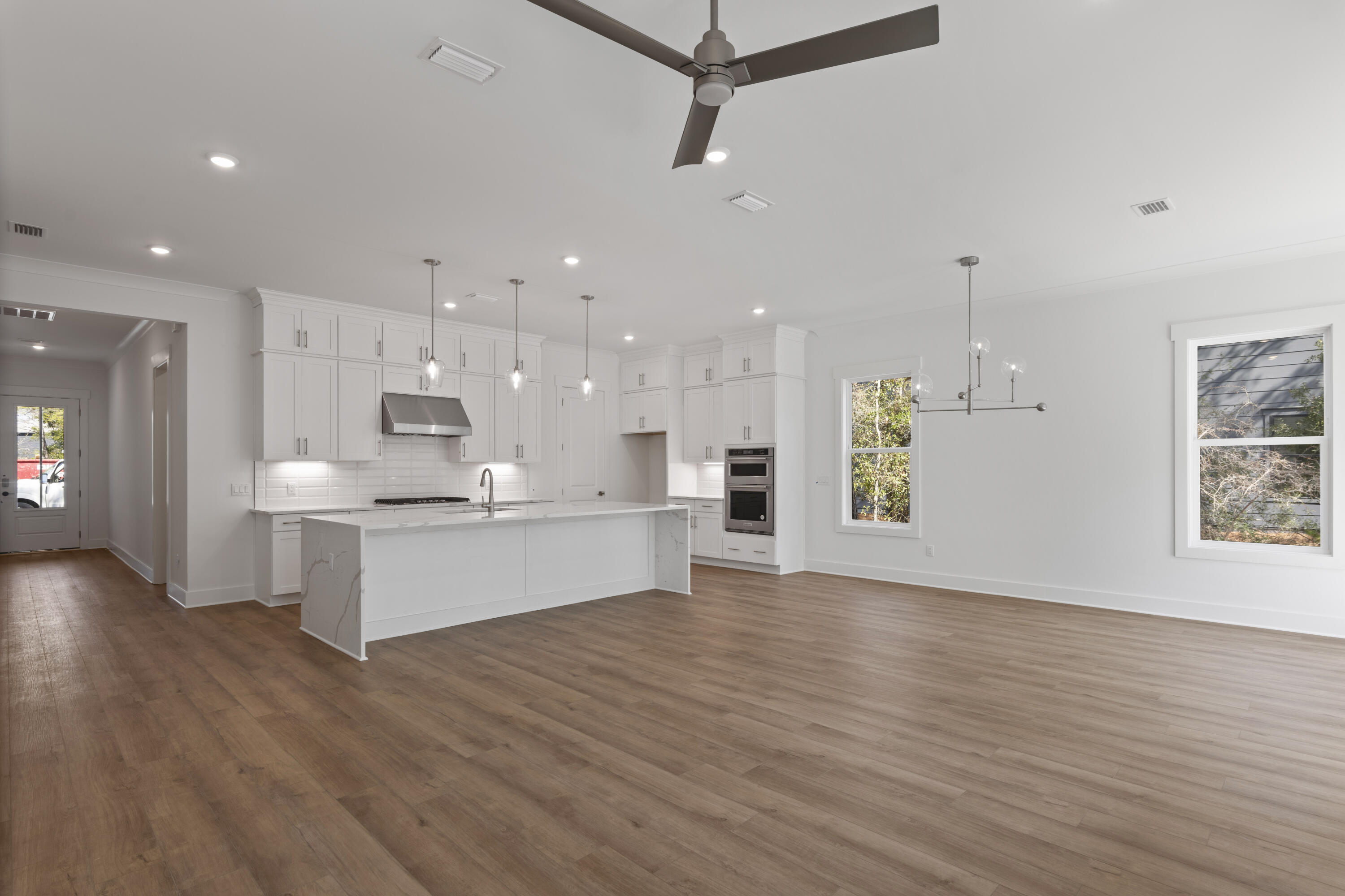 310 Channel Shl Drive, Unit LOT 13 Santa Rosa Beach, FL 32459 - Photo 28 of 77 a large kitchen with stainless steel appliances kitchen island a large counter top and a wooden floors