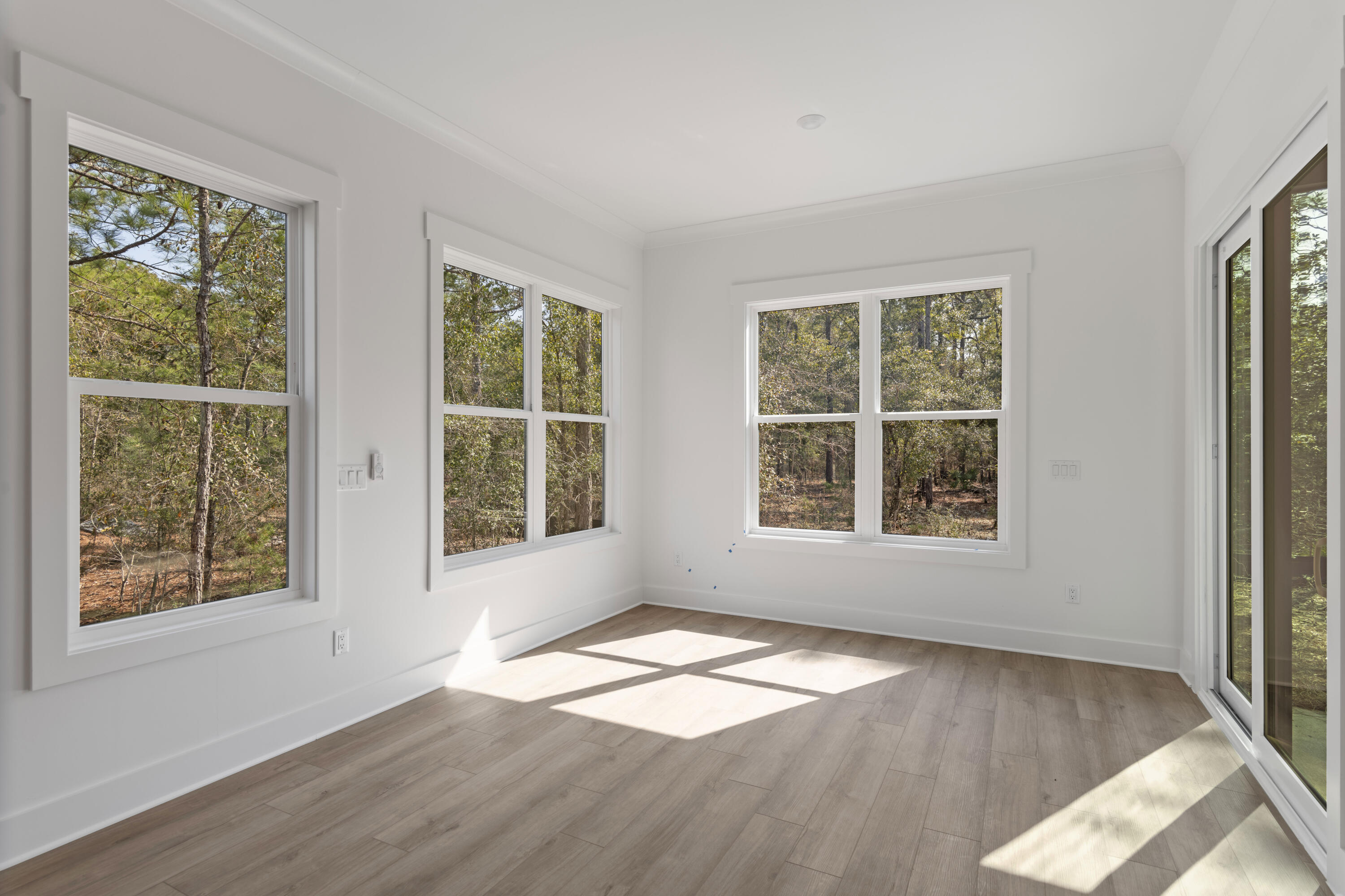 310 Channel Shl Drive, Unit LOT 13 Santa Rosa Beach, FL 32459 - Photo 35 of 77 a view of empty room with wooden floor and fan