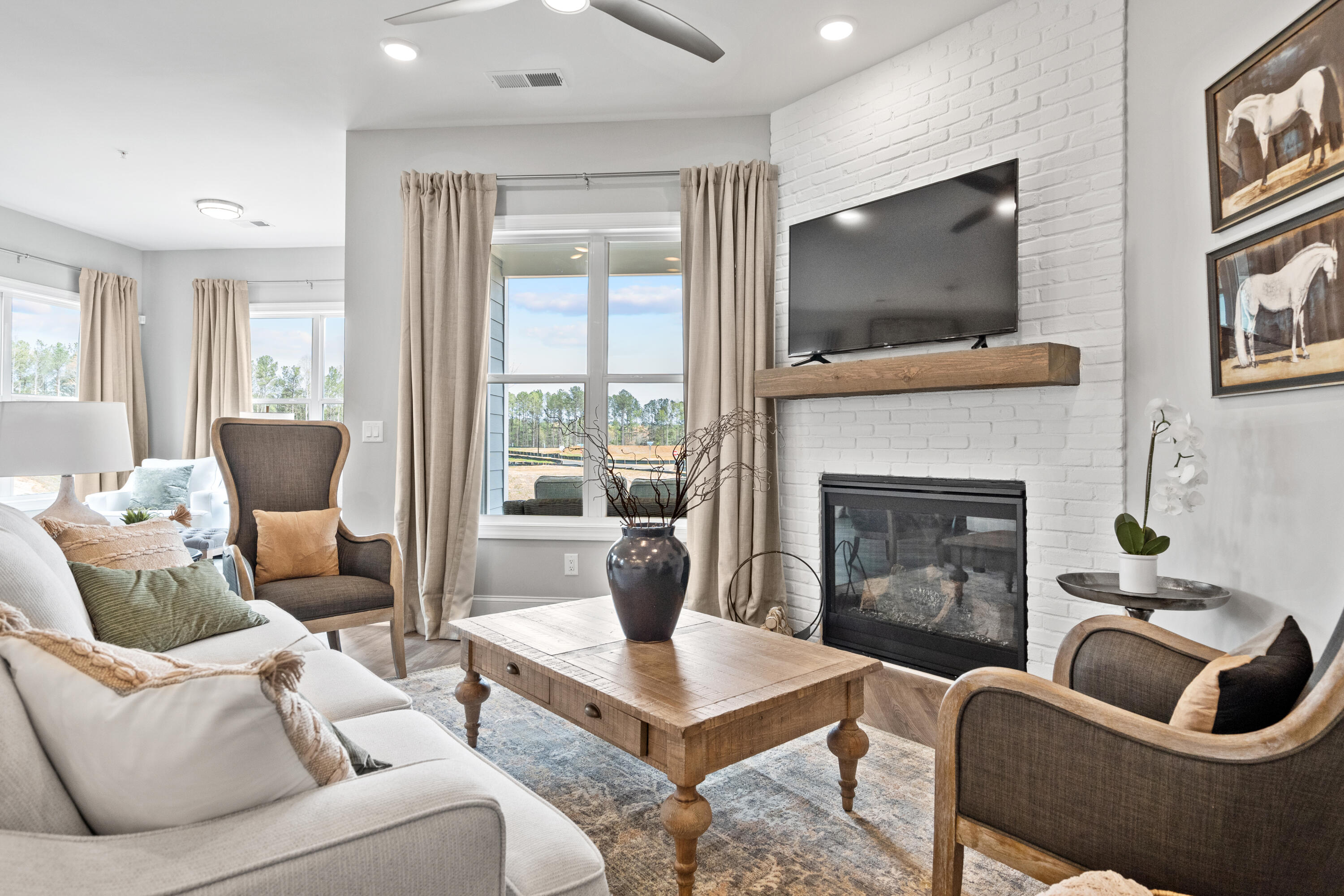 310 Channel Shl Drive, Unit LOT 13 Santa Rosa Beach, FL 32459 - Photo 41 of 77 a living room with furniture a flat screen tv and a fireplace