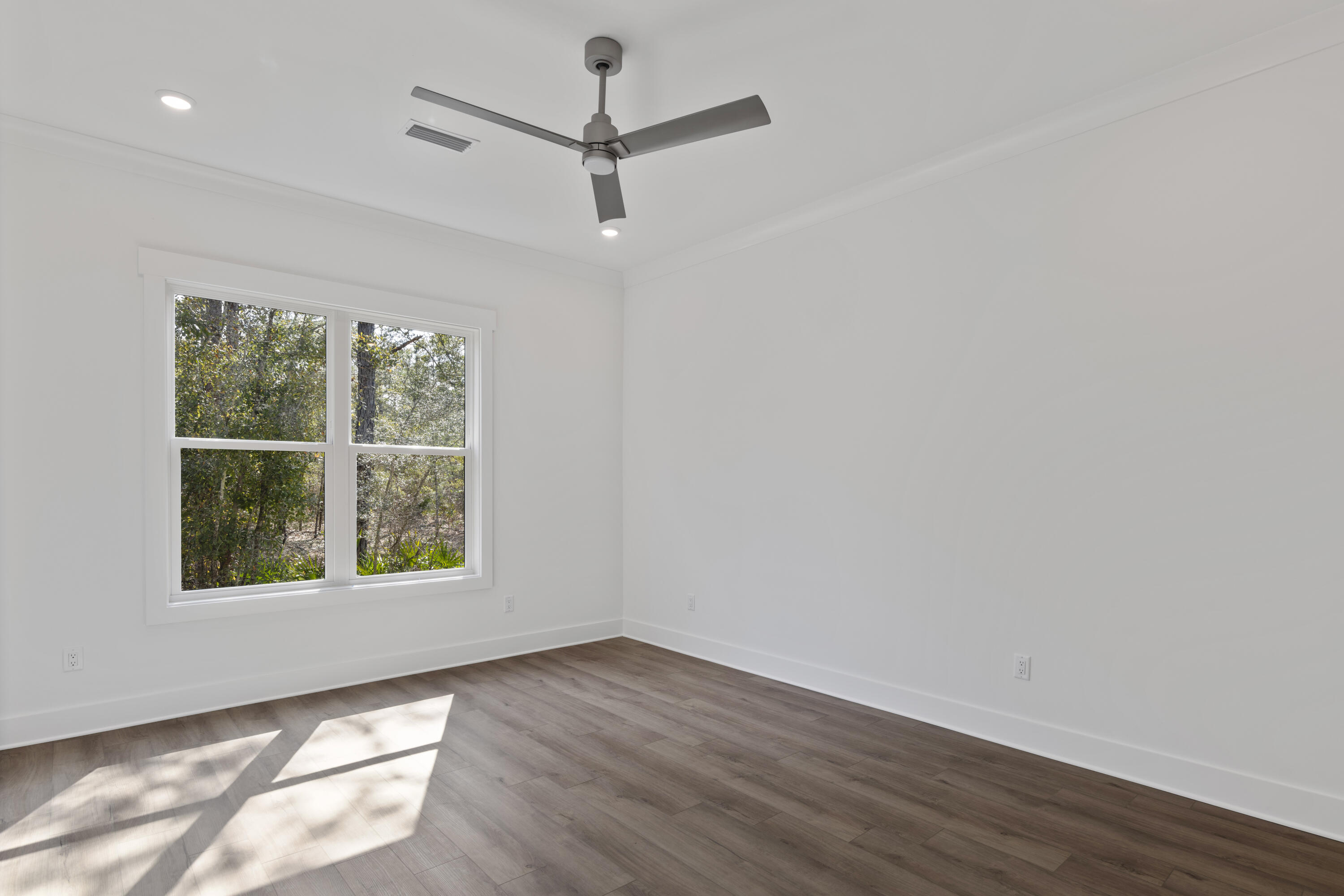 310 Channel Shl Drive, Unit LOT 13 Santa Rosa Beach, FL 32459 - Photo 60 of 77 an empty room with wooden floor and windows