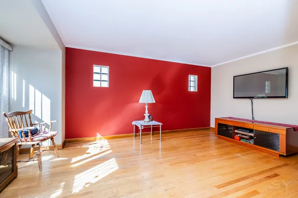 a bedroom with furniture and a flat screen tv