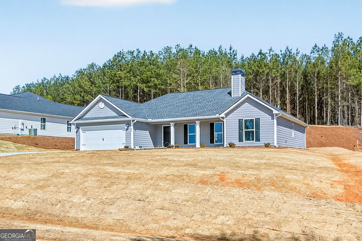 97 Wards Creek Road, Unit 1 Toccoa, GA 30577 - Photo 3 of 55 a front view of a house with a yard and garage
