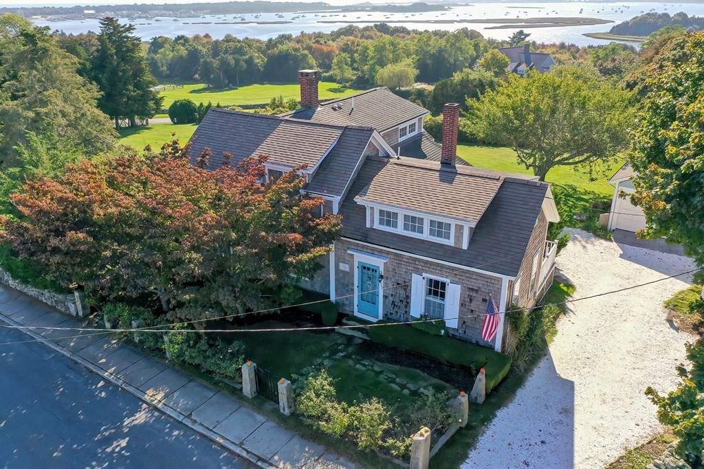 1919 Main Road Westport, MA 02791 - Photo 1 of 42 an aerial view of a house with a garden and lake view
