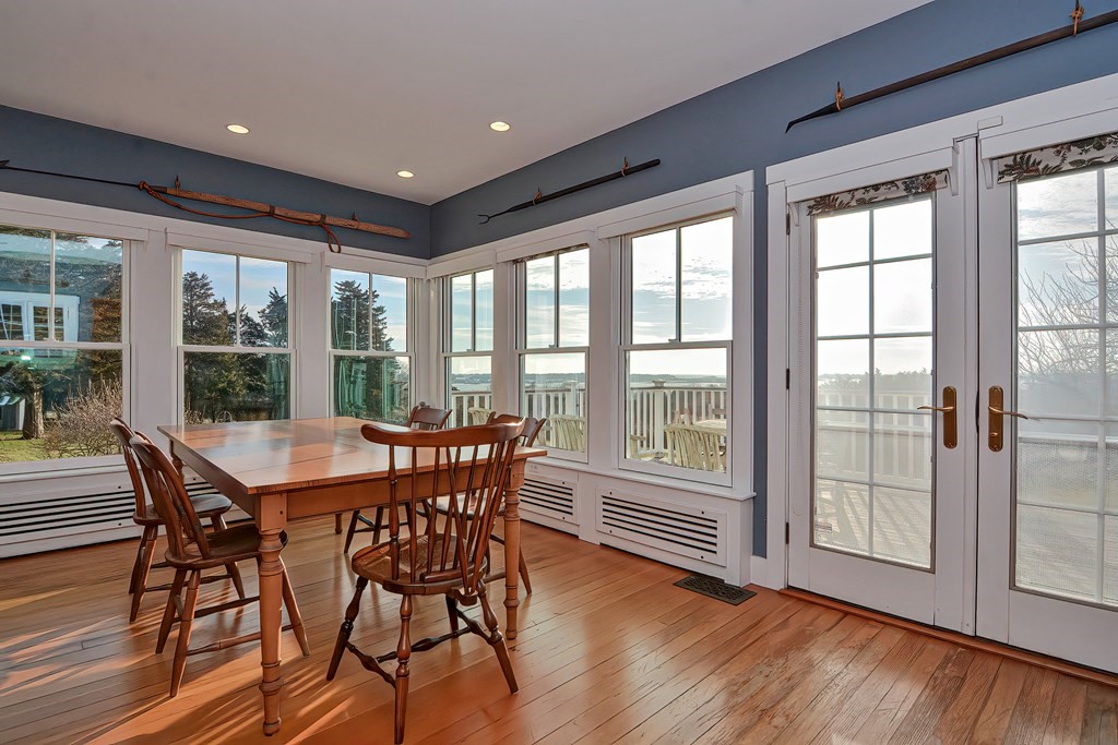 1919 Main Road Westport, MA 02791 - Photo 11 of 42 a dining room with furniture window and wooden floor