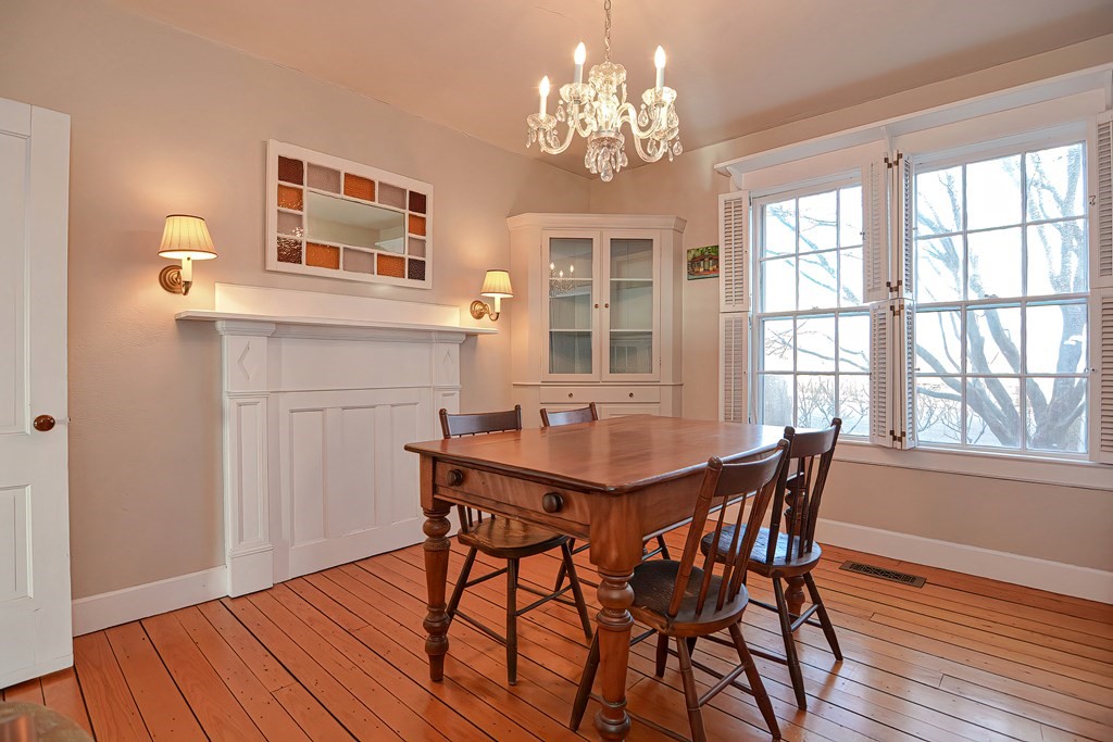 1919 Main Road Westport, MA 02791 - Photo 15 of 42 a view of a dining room with furniture window and wooden floor