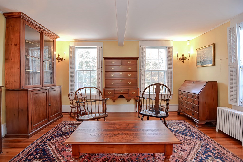 1919 Main Road Westport, MA 02791 - Photo 20 of 42 a living room with furniture a window and wooden floor