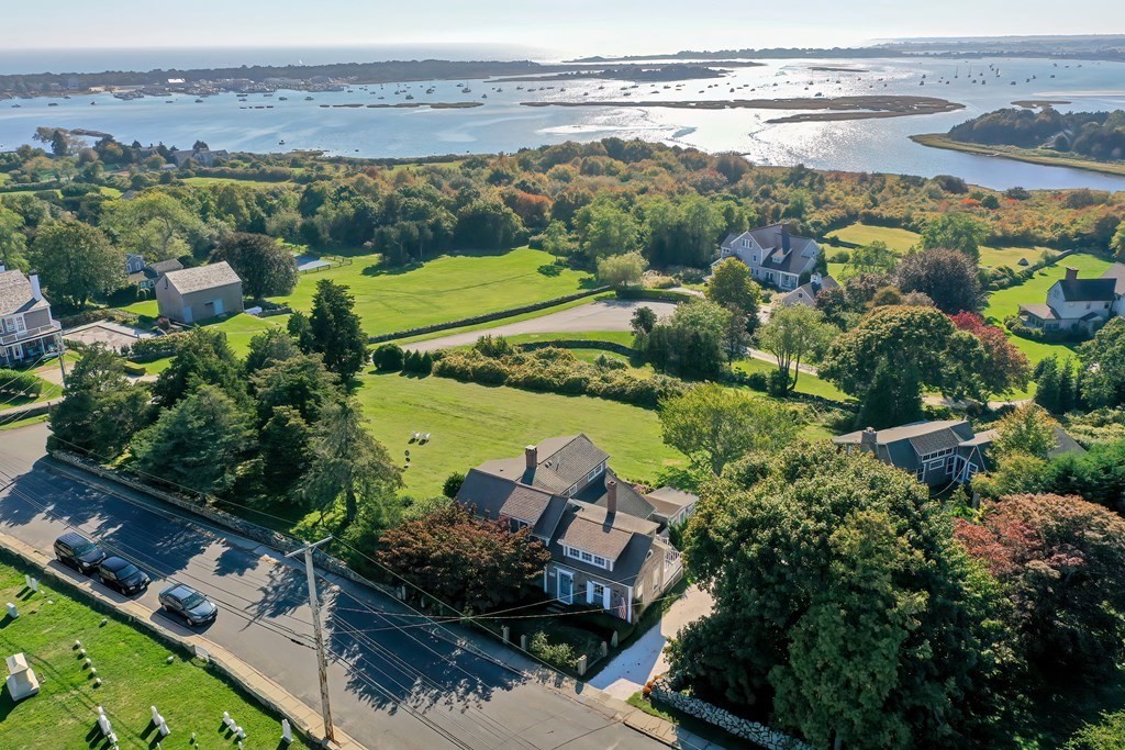 1919 Main Road Westport, MA 02791 - Photo 2 of 42 an aerial view of a city with lots of residential buildings ocean and mountain view in back