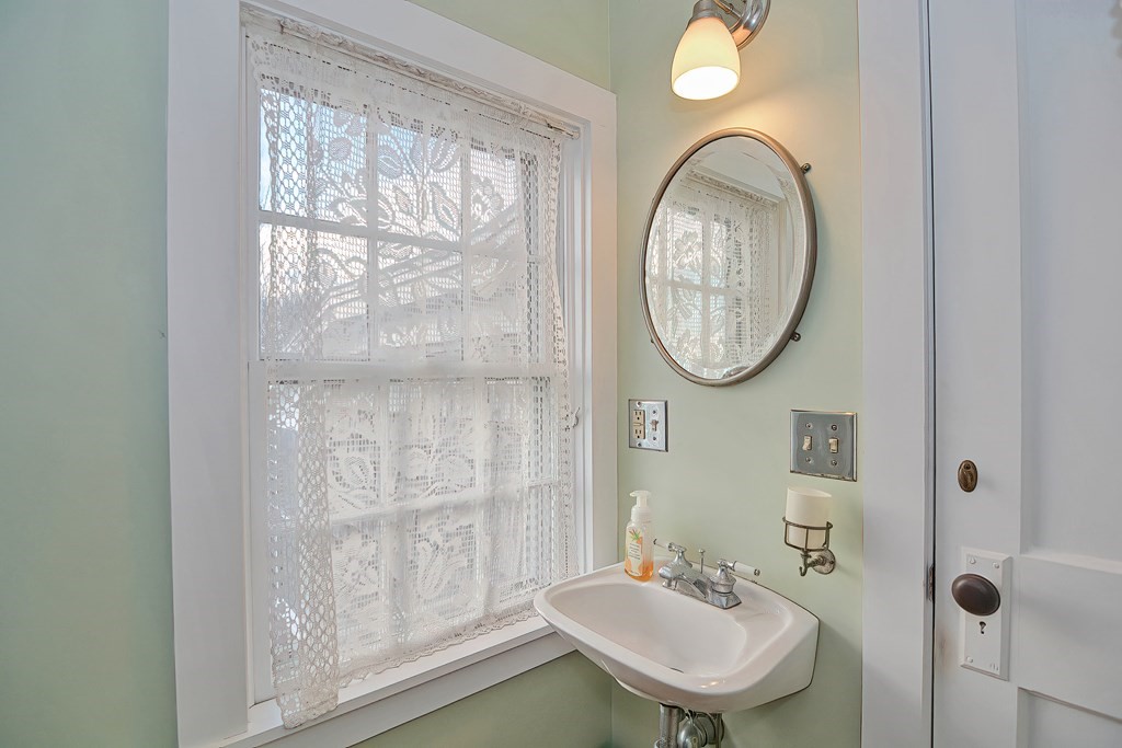 1919 Main Road Westport, MA 02791 - Photo 23 of 42 a bathroom with a sink and a mirror