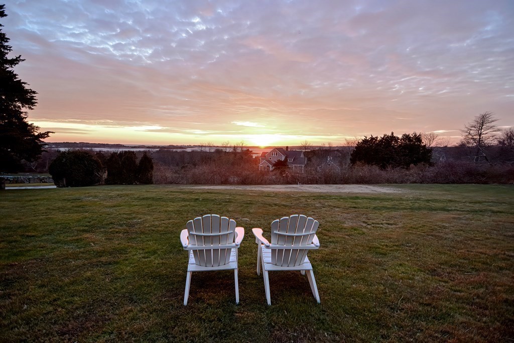 1919 Main Road Westport, MA 02791 - Photo 36 of 42 a view of a lake with table and chairs