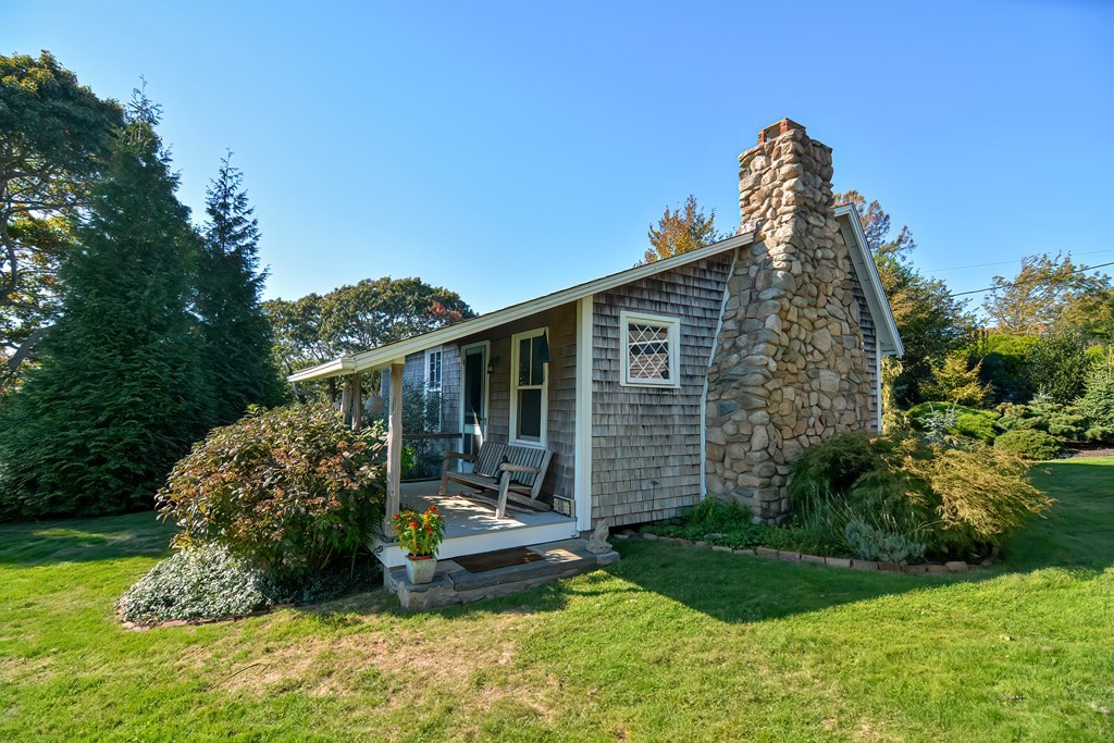 1919 Main Road Westport, MA 02791 - Photo 5 of 42 a view of a backyard with plants and large trees