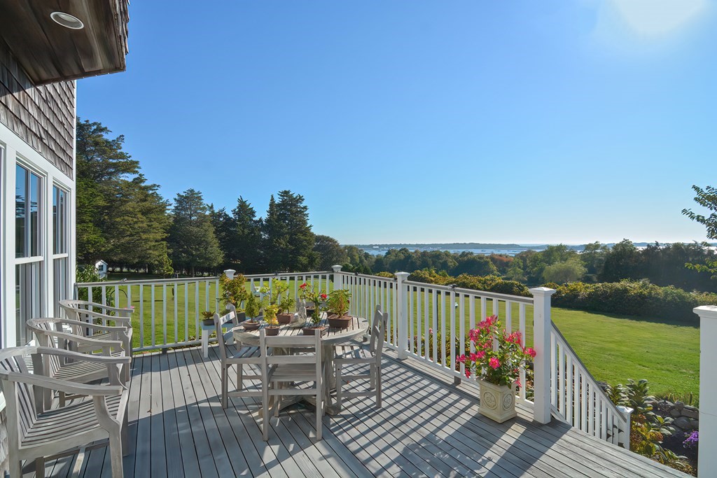 1919 Main Road Westport, MA 02791 - Photo 7 of 42 a view of a deck with two chair and a table