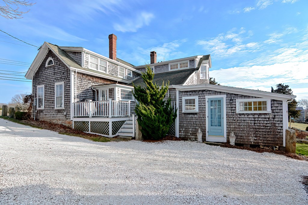 1919 Main Road Westport, MA 02791 - Photo 10 of 42 a view of a house with a barbeque and wooden fence
