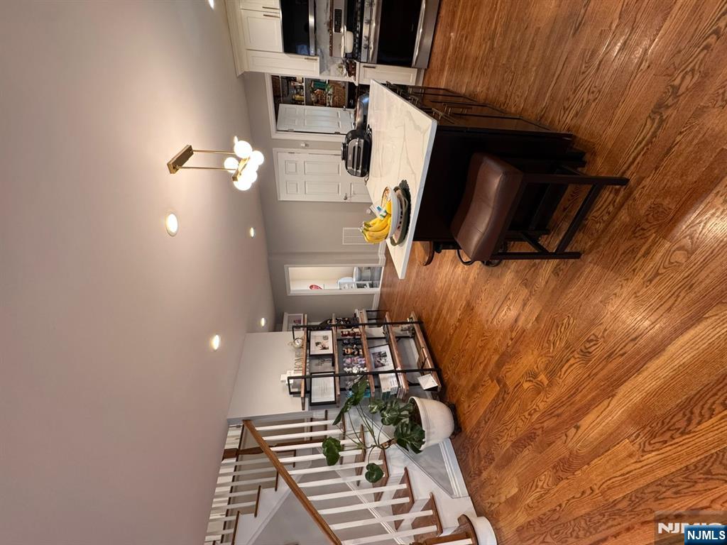 258 Hirliman Road Englewood, NJ 07631 - Photo 8 of 31 a living room with furniture and a wooden floor