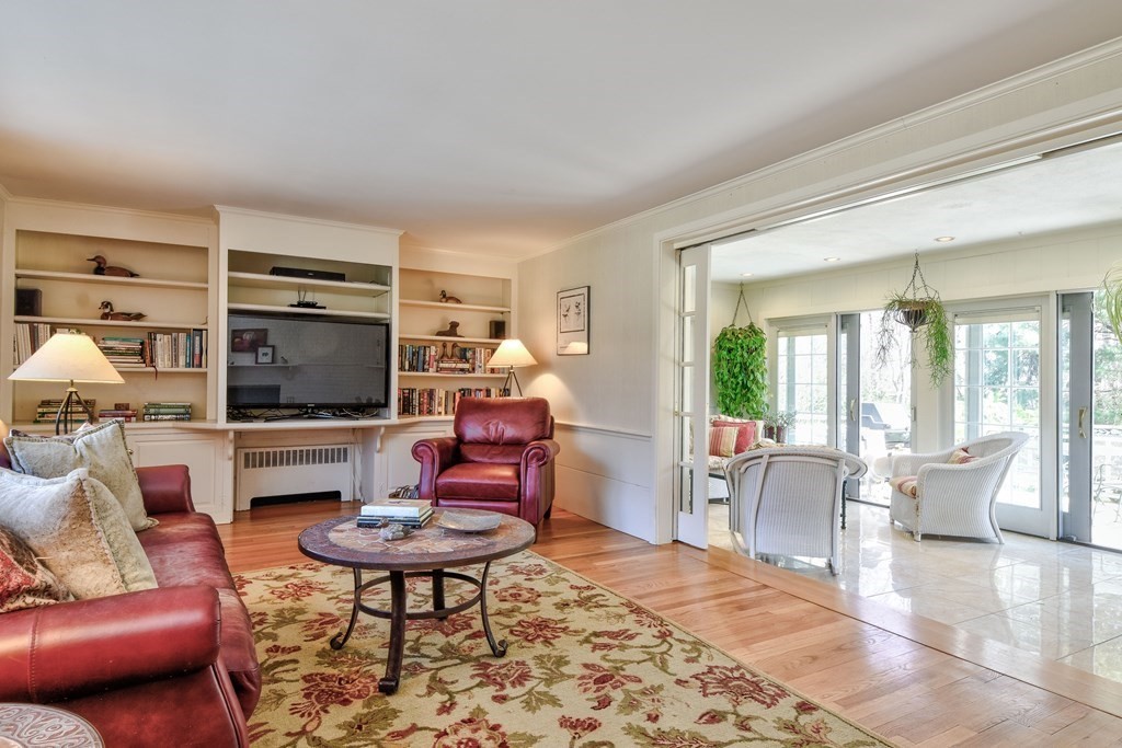 9 Salem Road Wellesley, MA 02481 - Photo 22 of 40 a living room with furniture flat screen tv and a fireplace