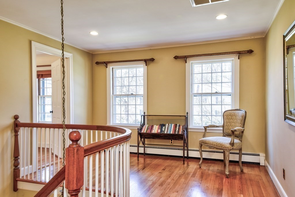 9 Salem Road Wellesley, MA 02481 - Photo 27 of 40 a balcony with furniture and wooden floor
