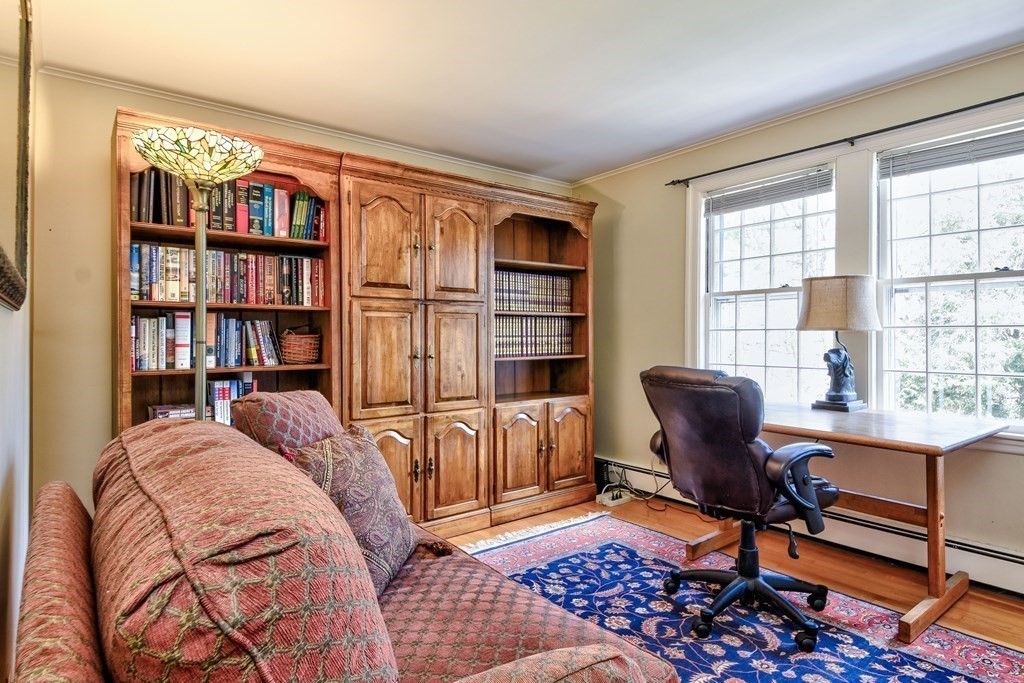 9 Salem Road Wellesley, MA 02481 - Photo 31 of 40 a bedroom with furniture and a book shelf
