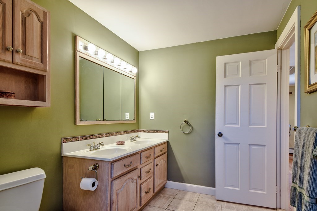 9 Salem Road Wellesley, MA 02481 - Photo 32 of 40 a view of bathroom with a sink and mirror