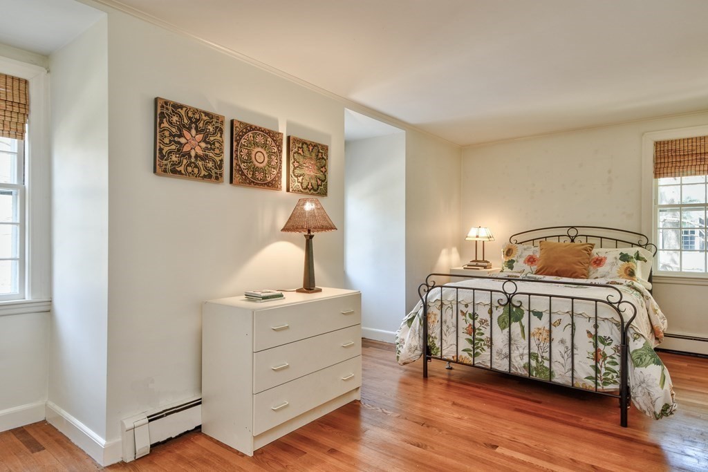 9 Salem Road Wellesley, MA 02481 - Photo 34 of 40 a view of a bedroom with a bed and wooden floor
