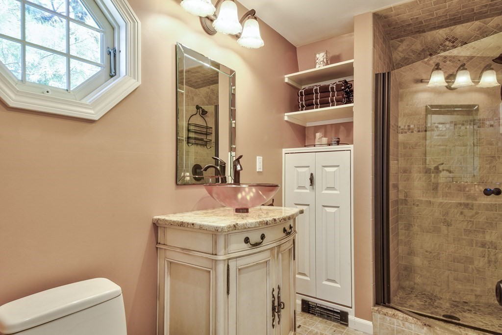 9 Salem Road Wellesley, MA 02481 - Photo 35 of 40 a bathroom with a sink a toilet and shower